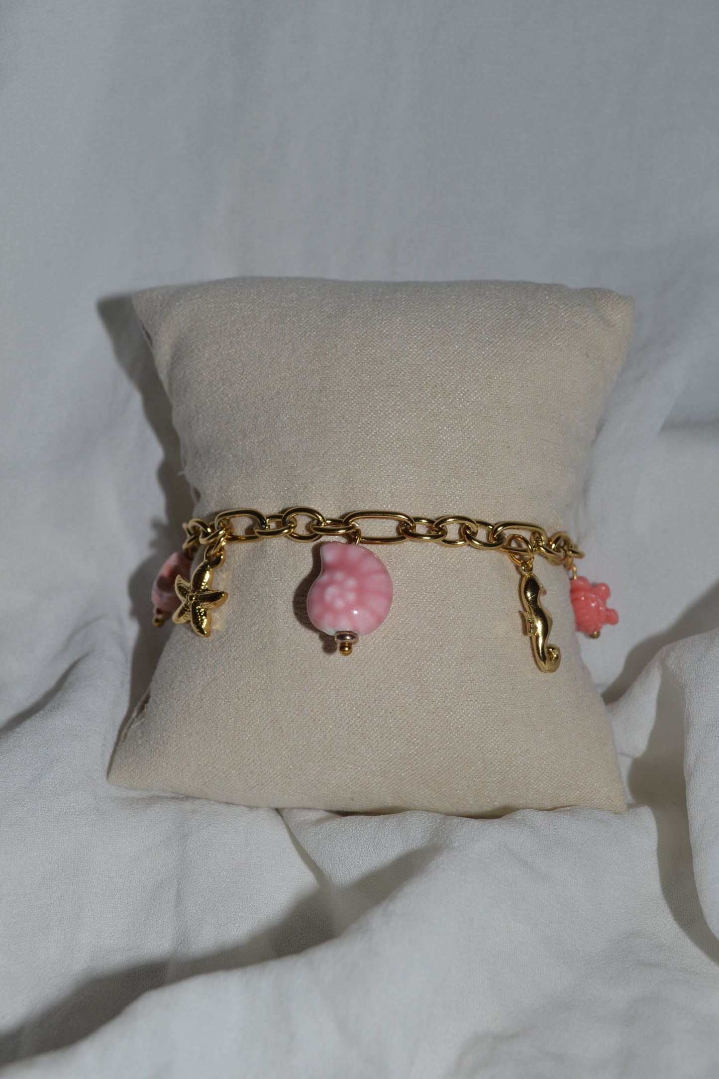 Bracelet breloque coquillage rose