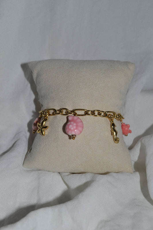 Bracelet breloque coquillage rose